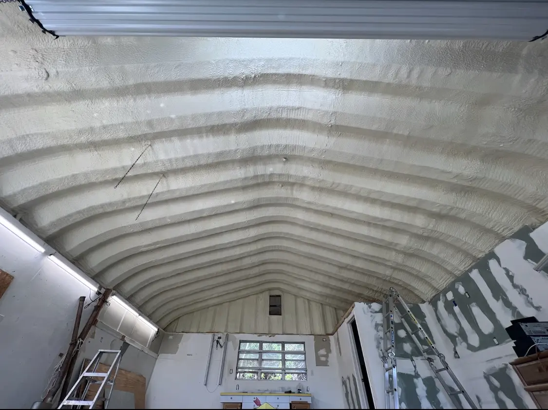 Spray polyurethane foam applied to the underside of a metal roof deck in Allouez